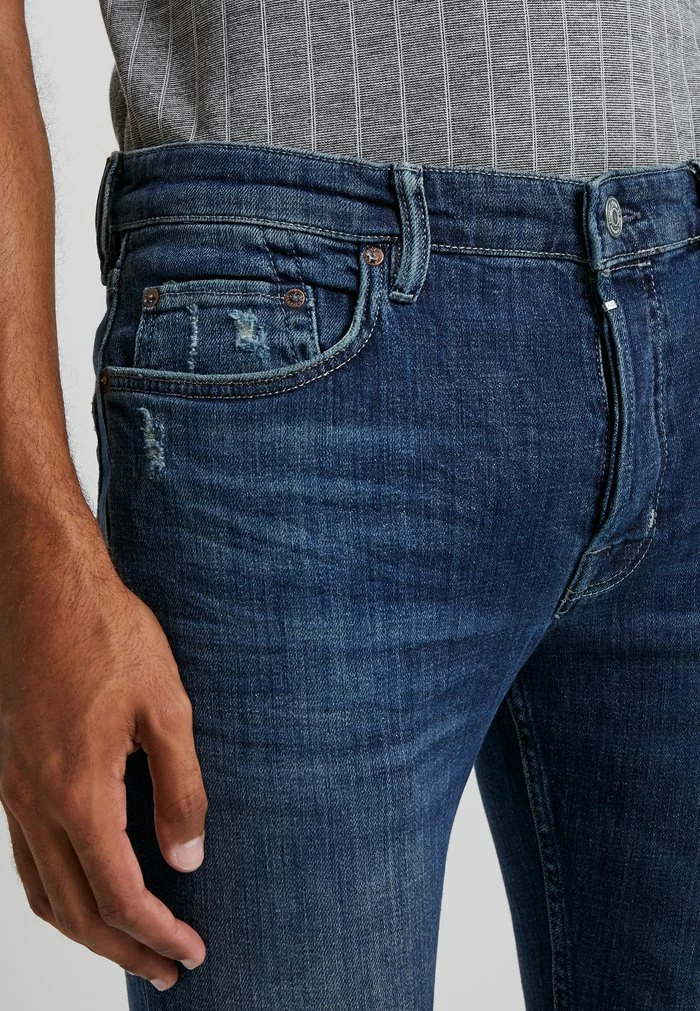 CIGARETTE DAMAGED - Slim fit jeans - indigo AllSaints CIGARETTE DAMAGED - Slim Fit Jeans - Indigo -AllSaintsSales 0b20dffb05454bcd8f9d5dcc2b5aa3d6