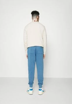 AllSaints NUTOPIA - Tracksuit Bottoms - Natural Indigo -AllSaintsSales 1f5df70183a04830b05778c88c999c0c