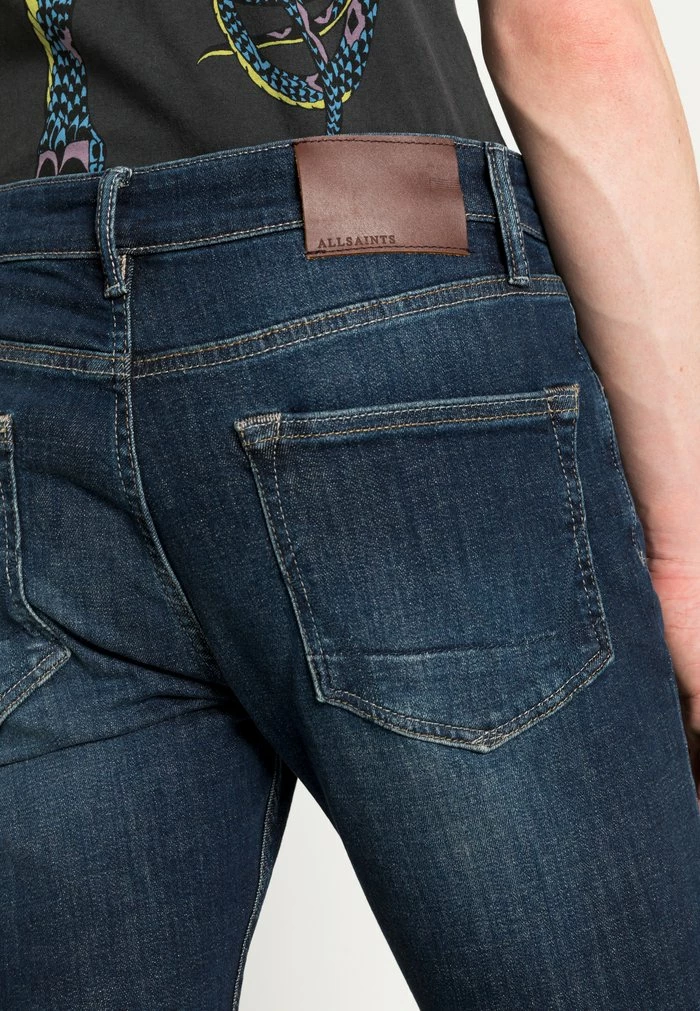 CIGARETTE - Slim fit jeans - indigo AllSaints CIGARETTE - Slim Fit Jeans - Indigo -AllSaintsSales 2d75e0ea3060498bb337aa6954058ad9